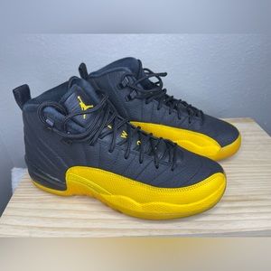 Black and yellow Jordan 12’s